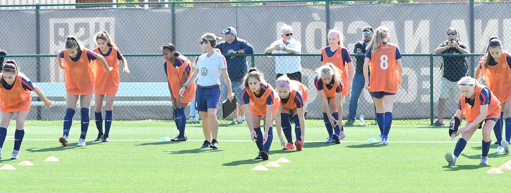 Girls participating in a soccer training session.