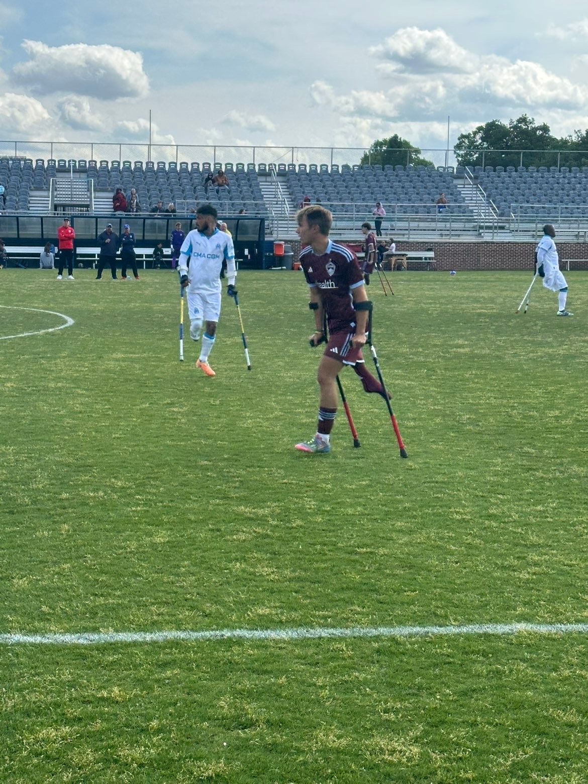 Two amputee soccer players playing soccer