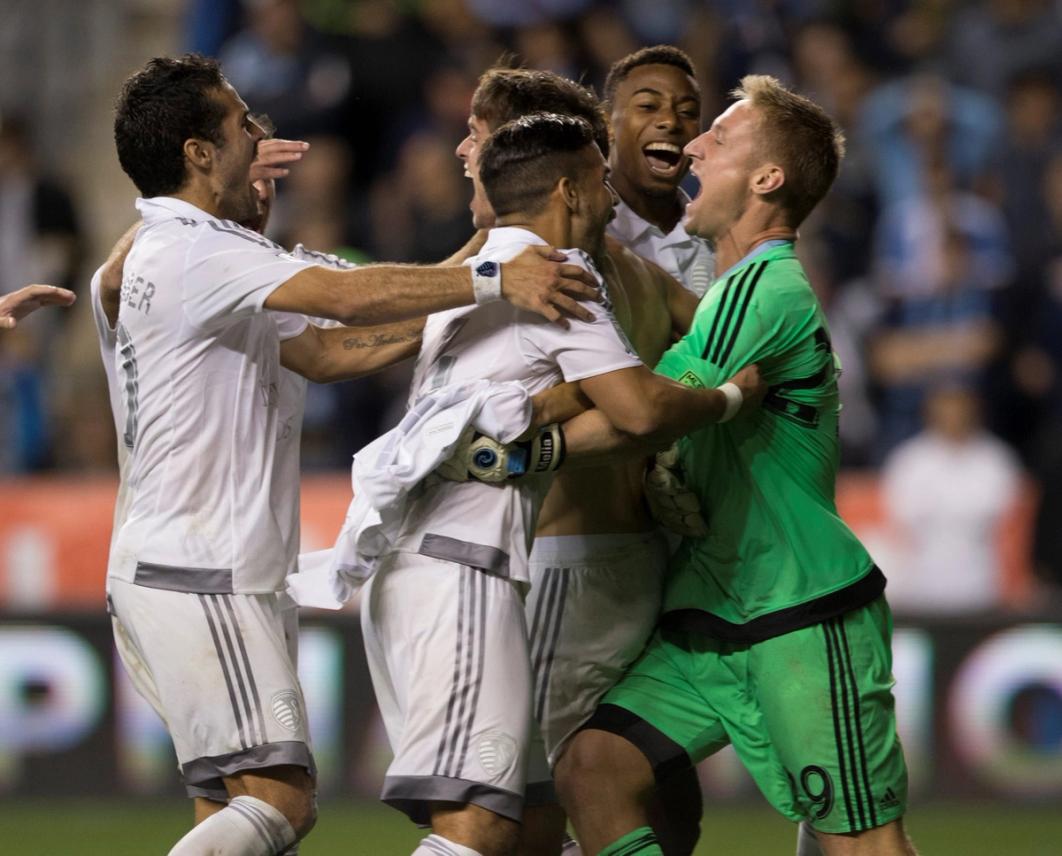 Melia in green celebrates with four teammates during the Open Cup