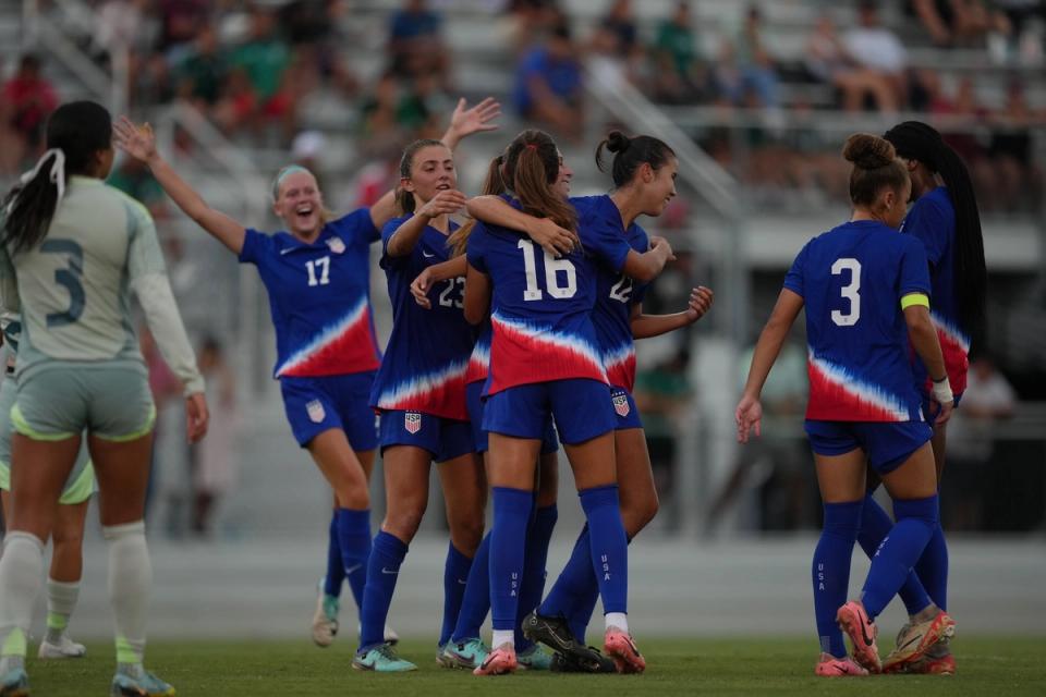 The US U20 WYNT celebrates on the field during a match against Mexico