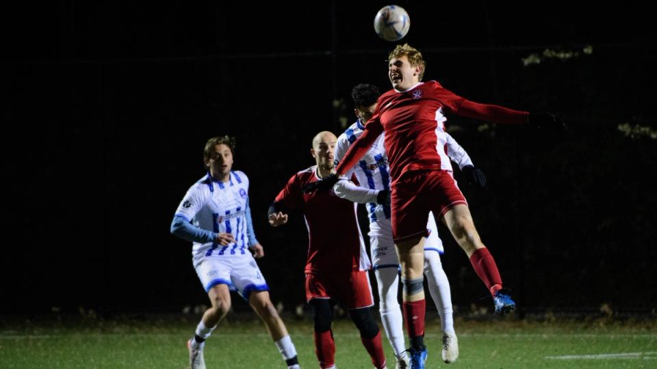 Chris Kondratowicz rises to win a ball