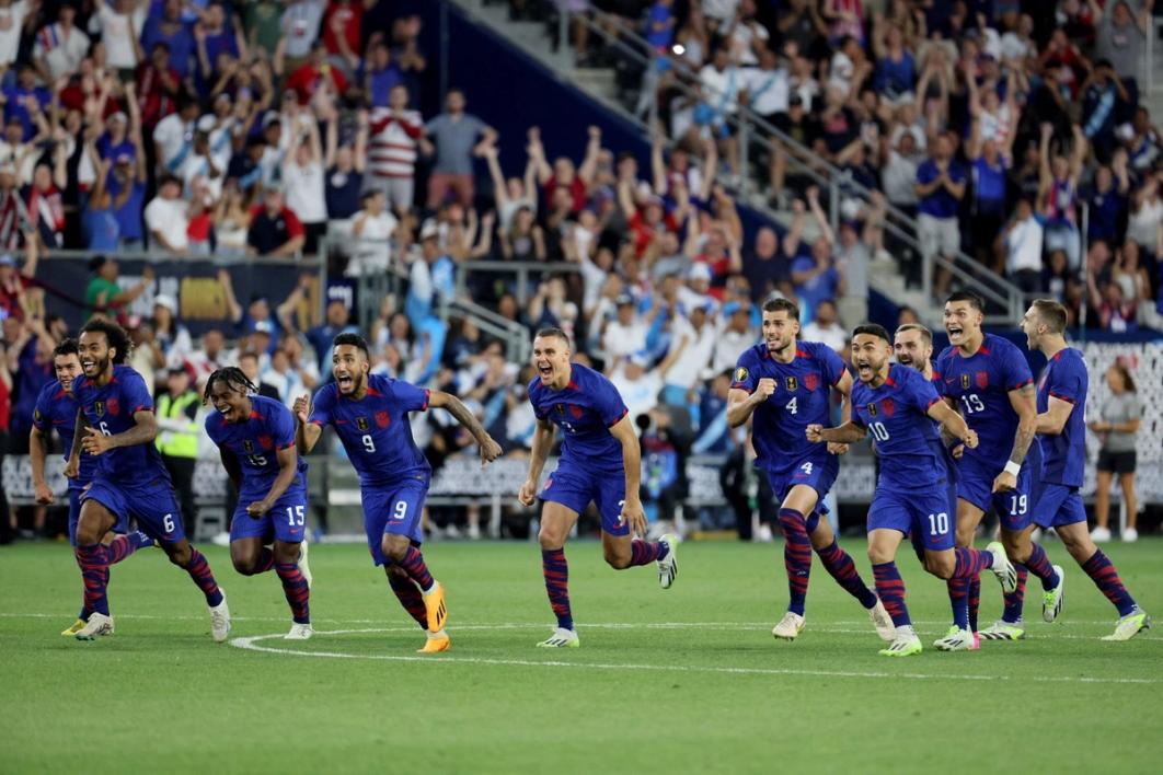 Long and members of the USMNT run in celebration after a penalty shootout during the 2023 Gold Cup