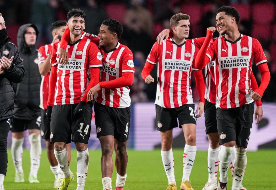 Ricardo Pepi and Malik Tillman celebrate with teammates for PSV