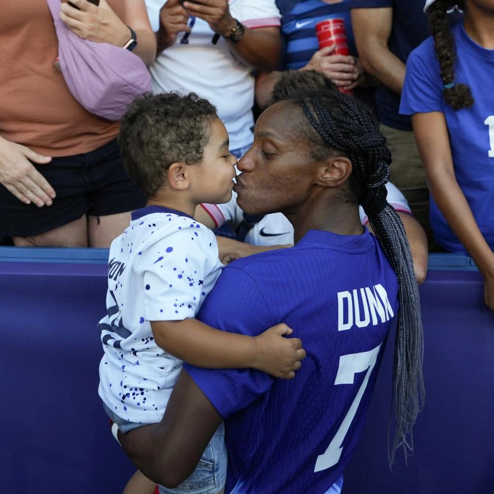 Crystal Dunn kisses her son Marcel