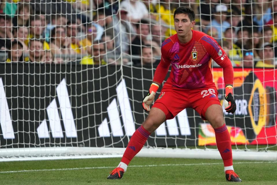 Patrick Schulte in goal in a red jersey and shorts