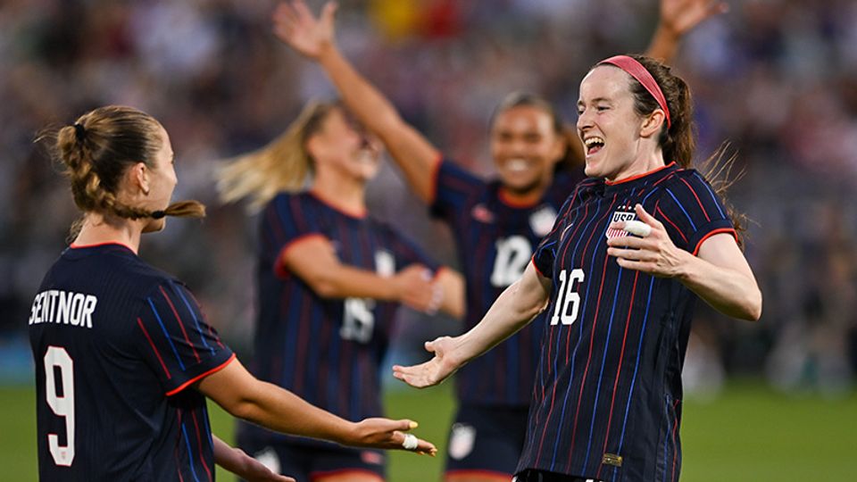 Rose Lavelle celebrates with Ally Sentnor