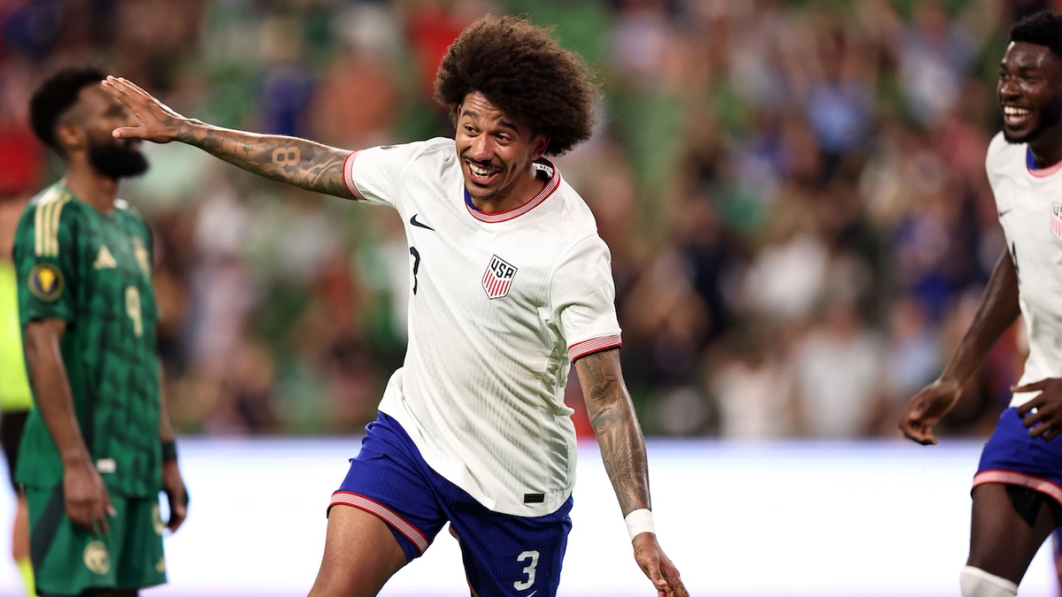 Chris Richards celebrating with a flying gesture 