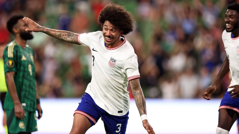 Chris Richards celebrating with a flying gesture 