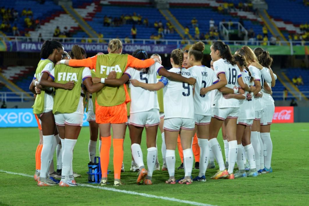 The U.S. U-20 WYNT huddles on the field during a match