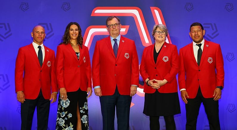 Mark Abbott, Chris Armas, Mary Harvey, Carli Lloyd and Nick Rimando wearing Hall of Fame red coats