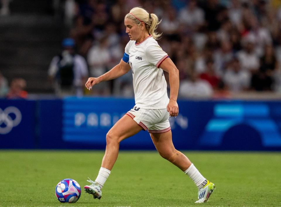 USA captain Lindsey Horan dribbes the ball up field during a match against Australia