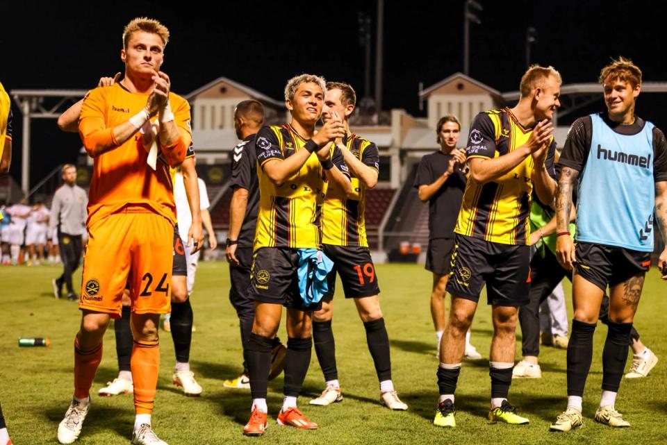 Five Charleston Battery players smile and clap after a 2024 US Open Cup match