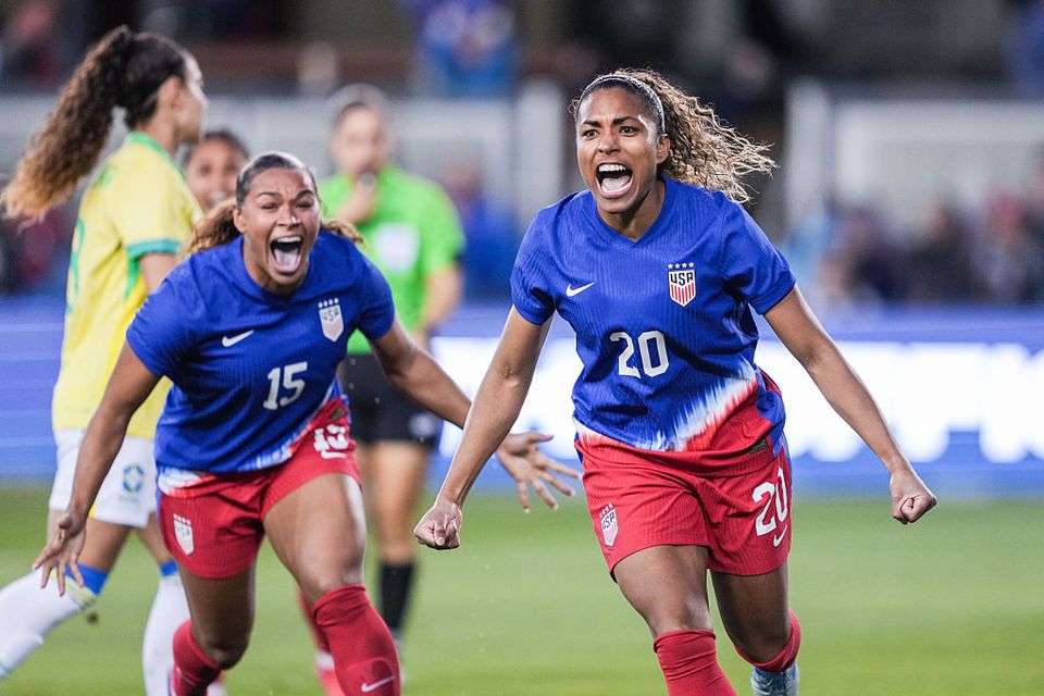 Catarina Macario running and shouting in celebration after scoring a goal