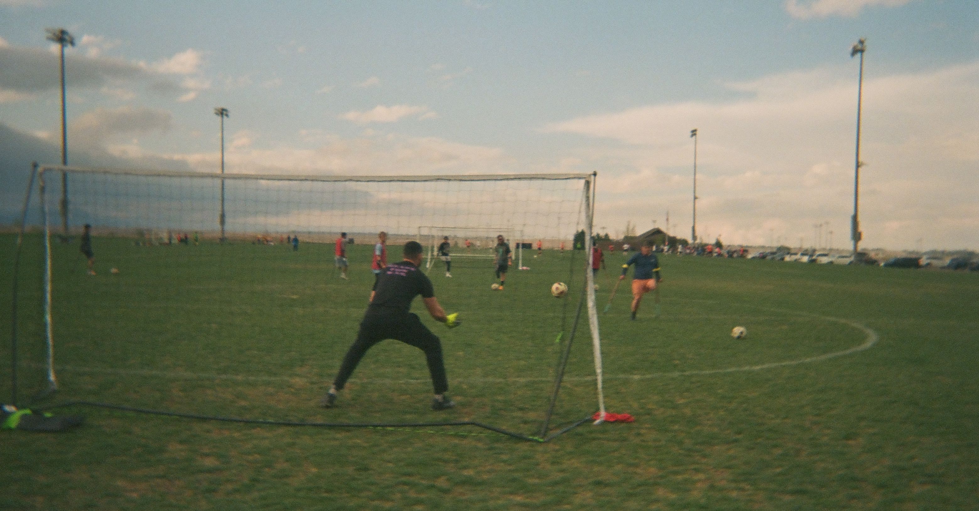 Youth amputee soccer player taking a shot during a match.