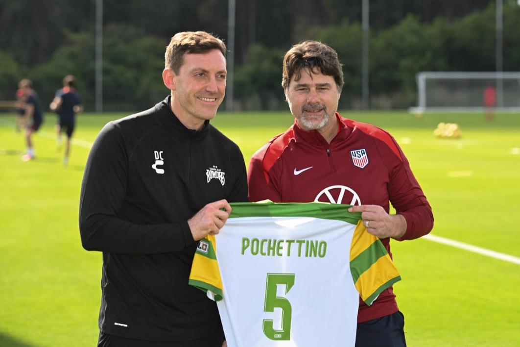 Tampa Bay Rowdies head coach Dominic Casciato presents USMNT head coach Mauricio Pochettino with a jersey during training the day before playing Uruguay in an international friendly in Tampa, Fla. in 2025