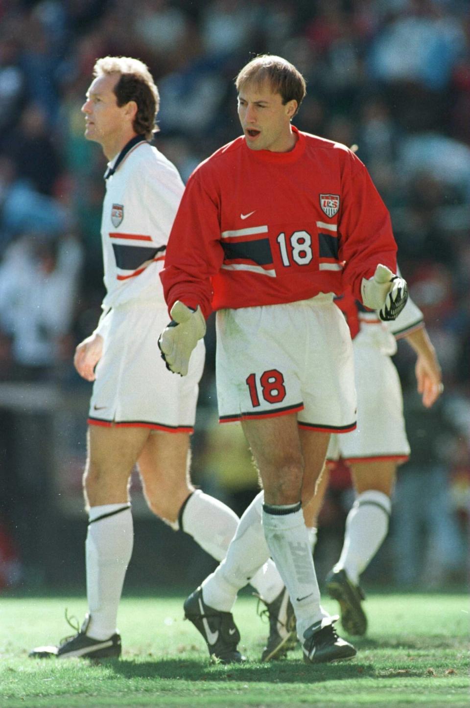 goalkeeper kasey keller in red jersey and white shorts