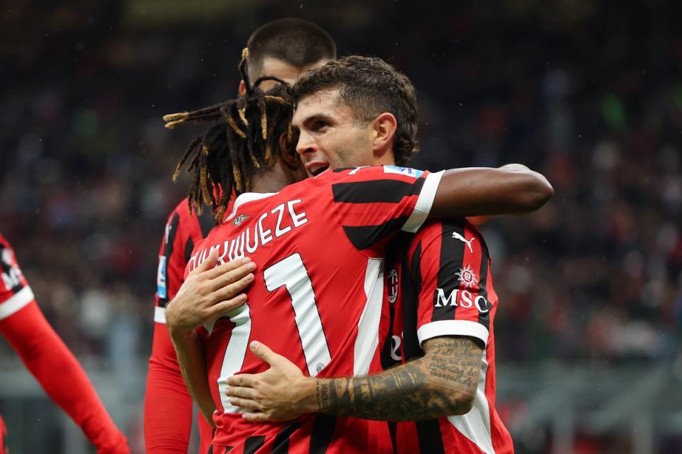 Christian Pulisic celebrates after assisting for AC Milan