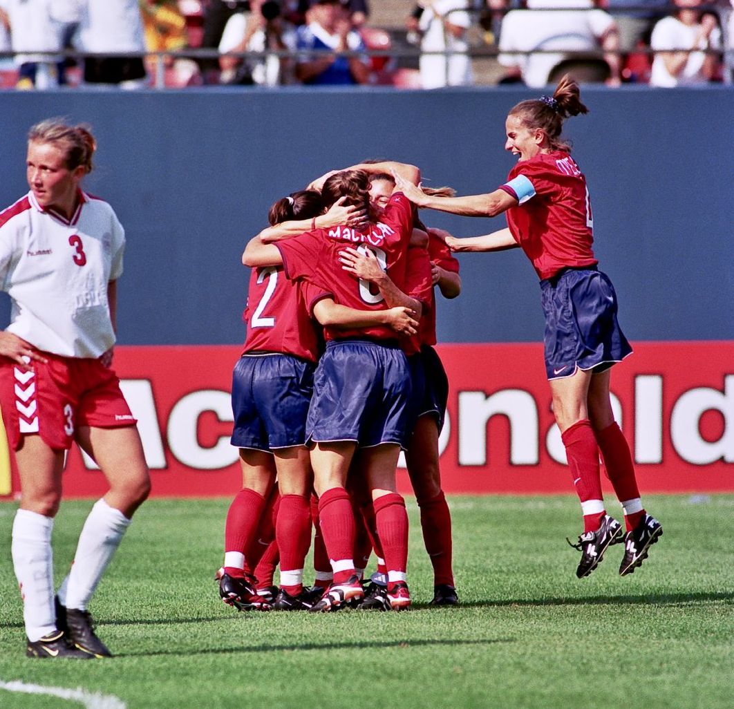 uswnt teammates celebrating on the field