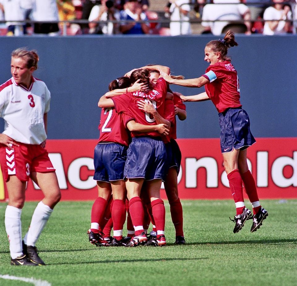 uswnt teammates celebrating on the field