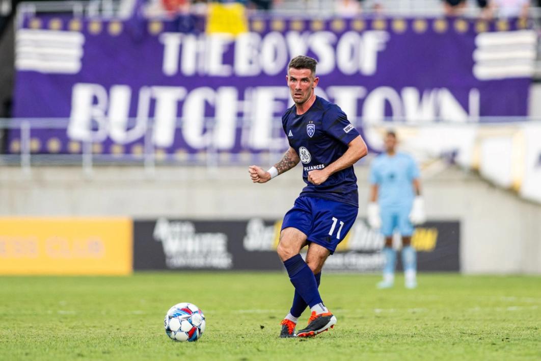 McCabe preparing to kick a ball during a Louisville City match