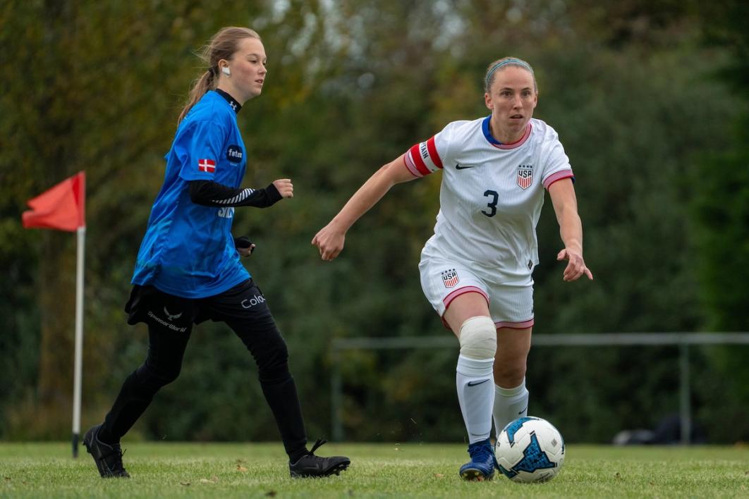 Annie Wickett dribbles around a defender
