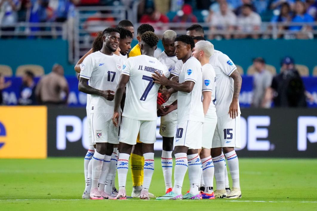 Members of the Panama National Team huddle up on the field