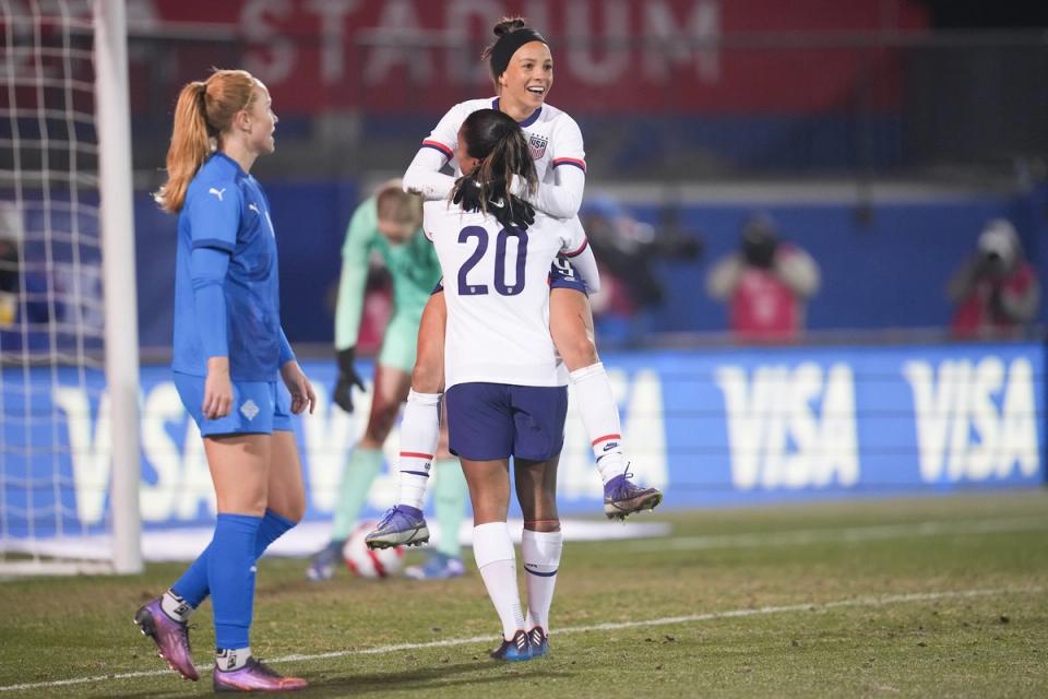 Mallory Swanson celebrates in a game against Iceland