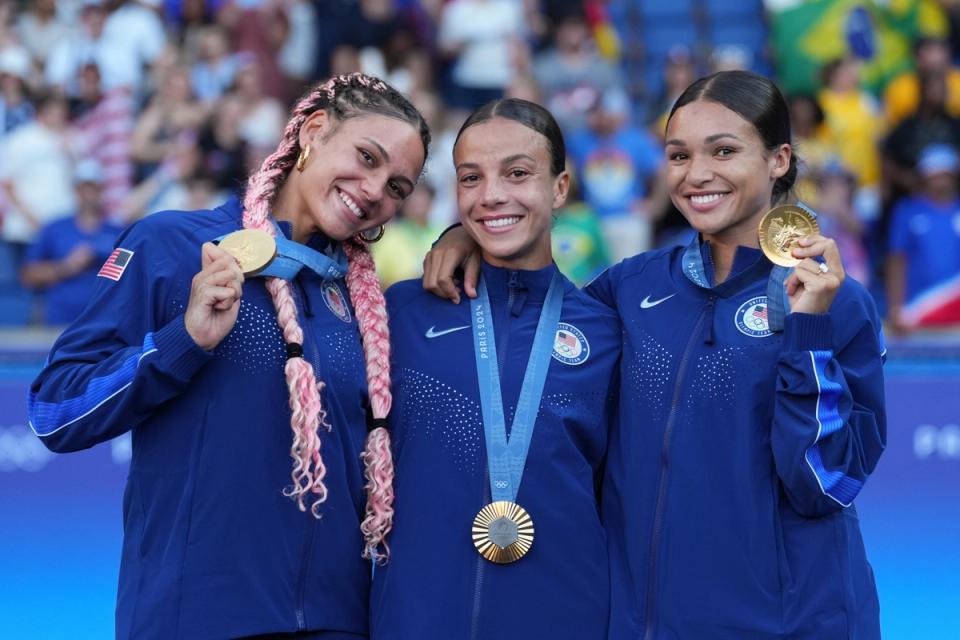 PARIS, FRANCE - AUGUST 10: Trinity Rodman #5, Mallory Swanson #9, and Sophia Smith #11 of the United States pose with their gold medals during the Gold Medal Ceremony after the Women's Gold Medal match during the Olympic Games Paris 2024 at Parc des Princes on August 10, 2024 in Paris, France. (Photo by Brad Smith/ISI/Getty Images)