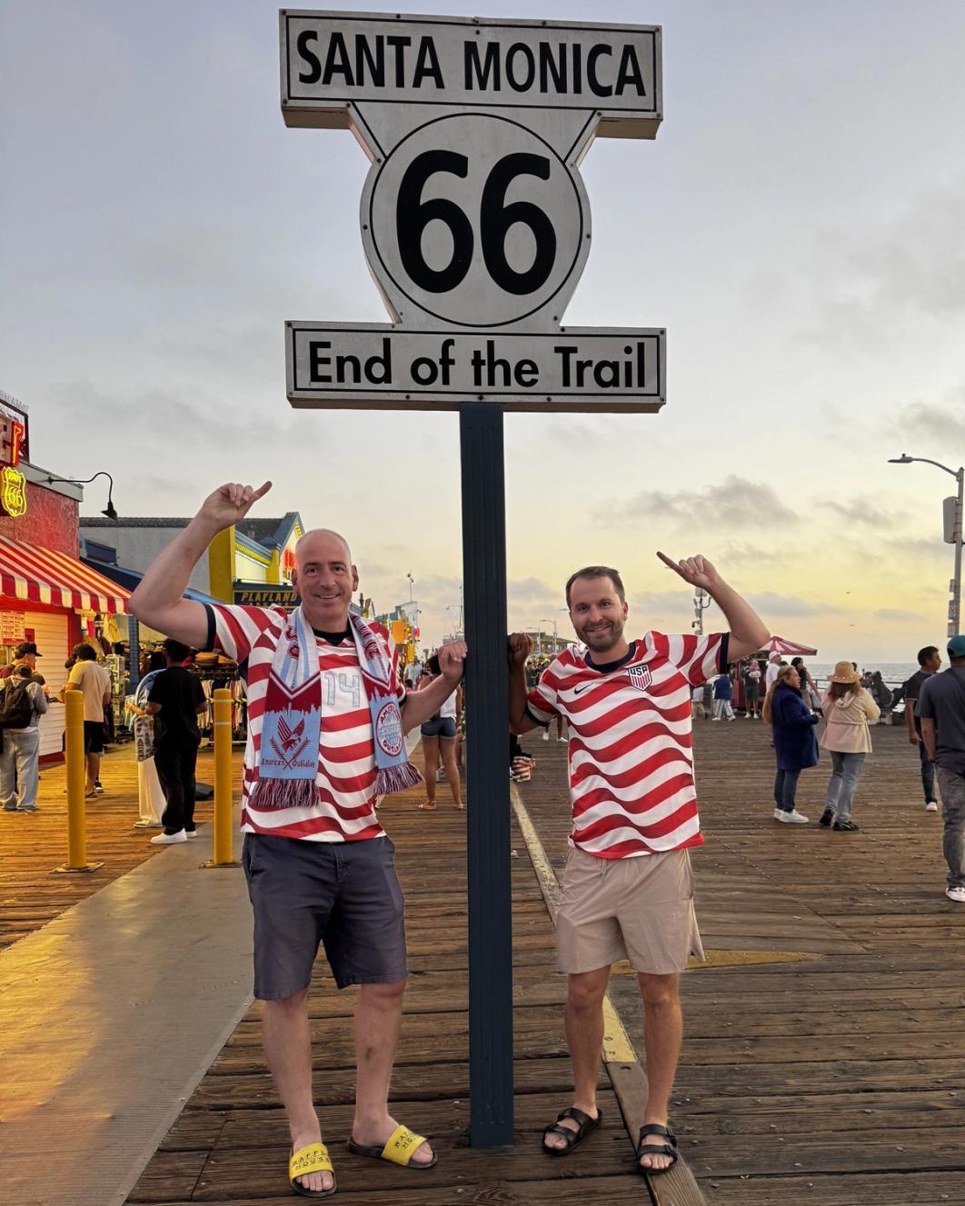Labas (left) and Logan Pedersen (right) at Route 66’s terminus on the Santa Monica Pier (Photo: Phil Labas)
