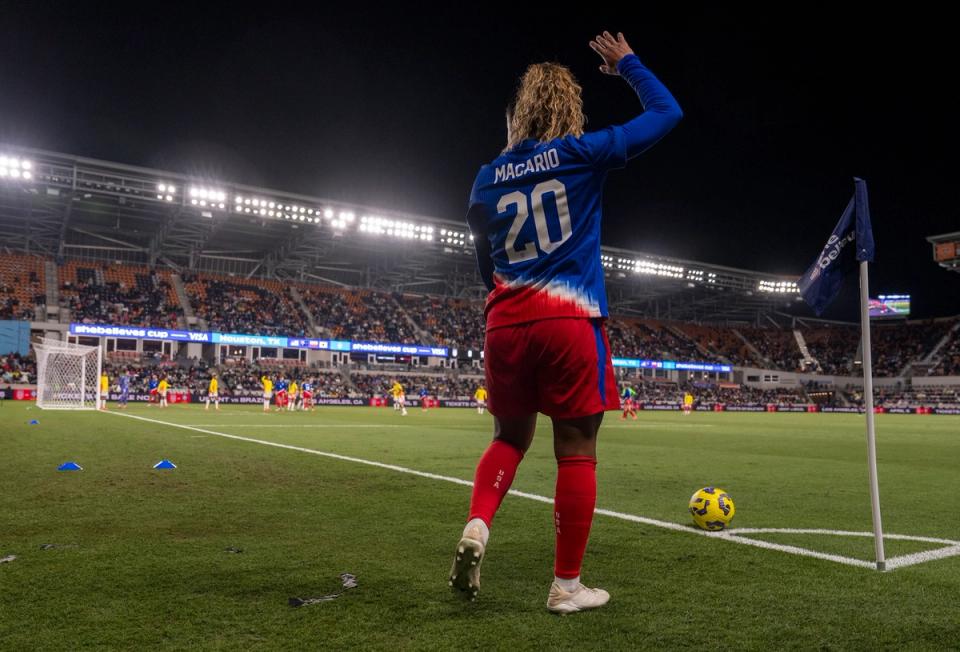 Cat Macario gets ready to take a corner kick during a match against Colombia