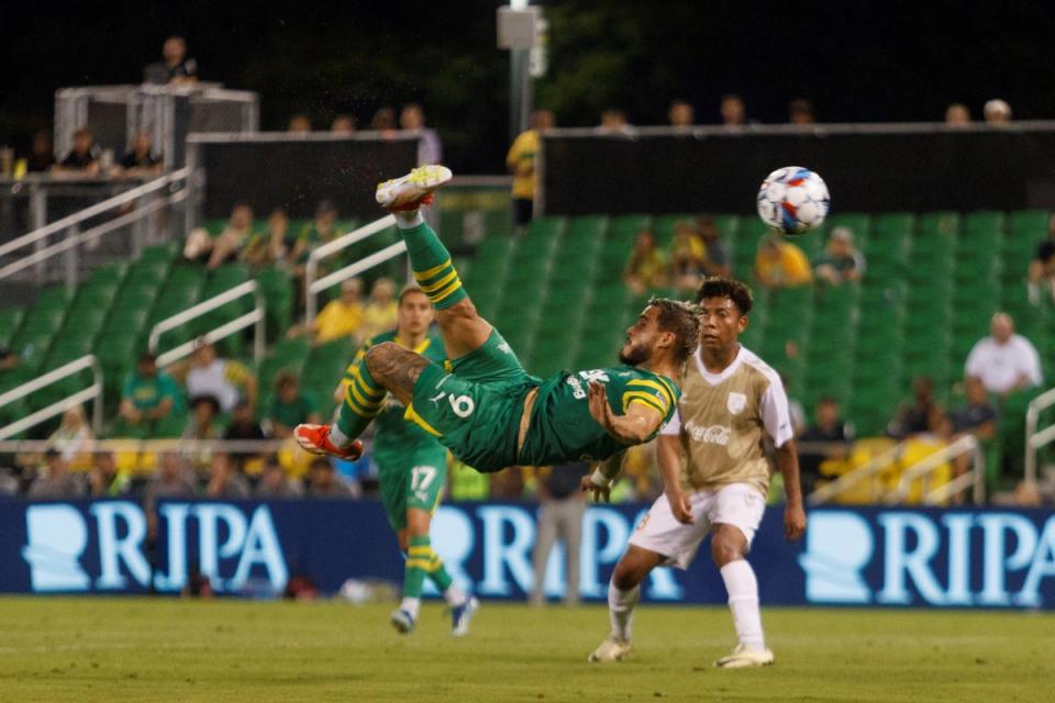 A Tampa Bay Rowdies player attempting a bicycle kick