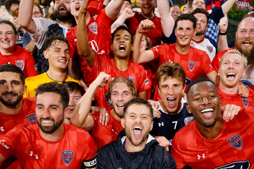 Indy Eleven players celebrate with the crowd after an upset victory over Atlanta United