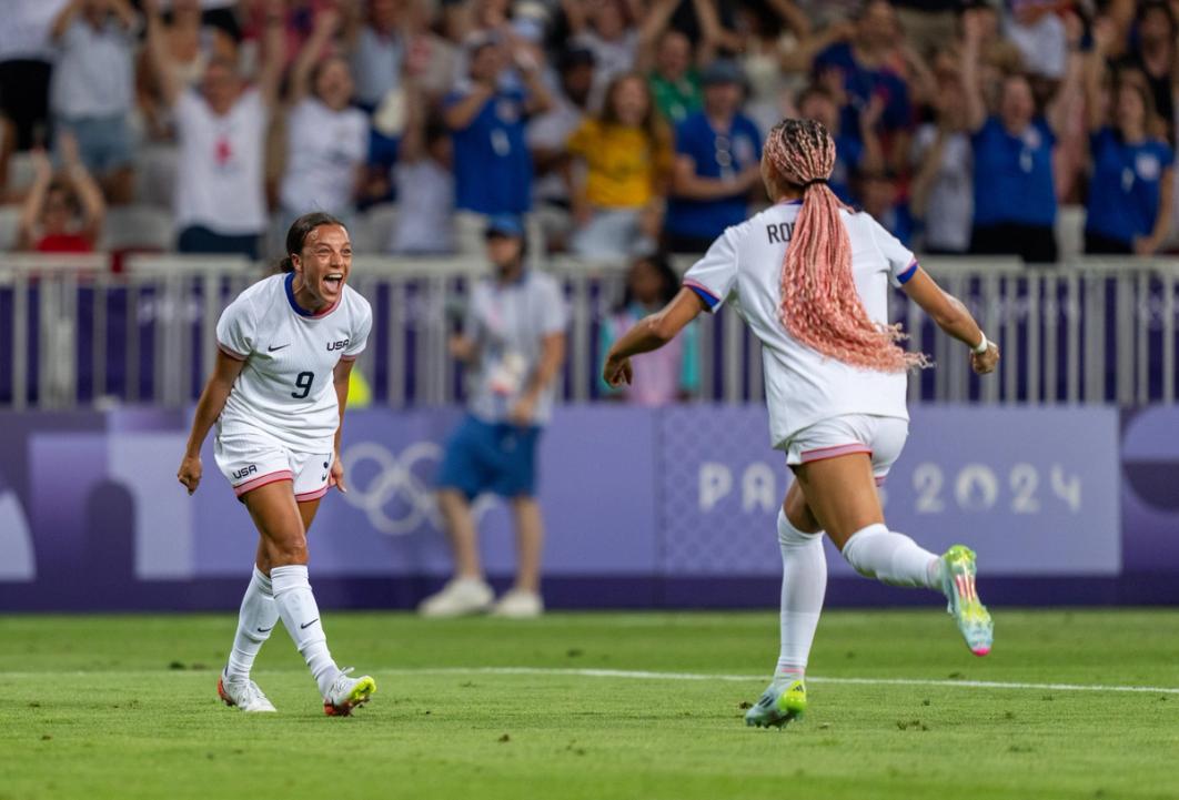 NICE, FRANCE - JULY 25: Mallory Swanson #9 of the United States celebrates with Trinity Rodman #5 during the Women's group B match between United States and Zambia during the Olympic Games Paris 2024 at Stade de Nice on July 25, 2024 in Nice , France. (Photo by Brad Smith/ISI/Getty Images).