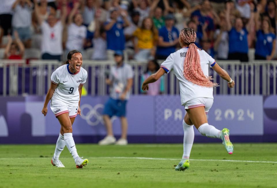 NICE, FRANCE - JULY 25: Mallory Swanson #9 of the United States celebrates with Trinity Rodman #5 during the Women's group B match between United States and Zambia during the Olympic Games Paris 2024 at Stade de Nice on July 25, 2024 in Nice , France. (Photo by Brad Smith/ISI/Getty Images).