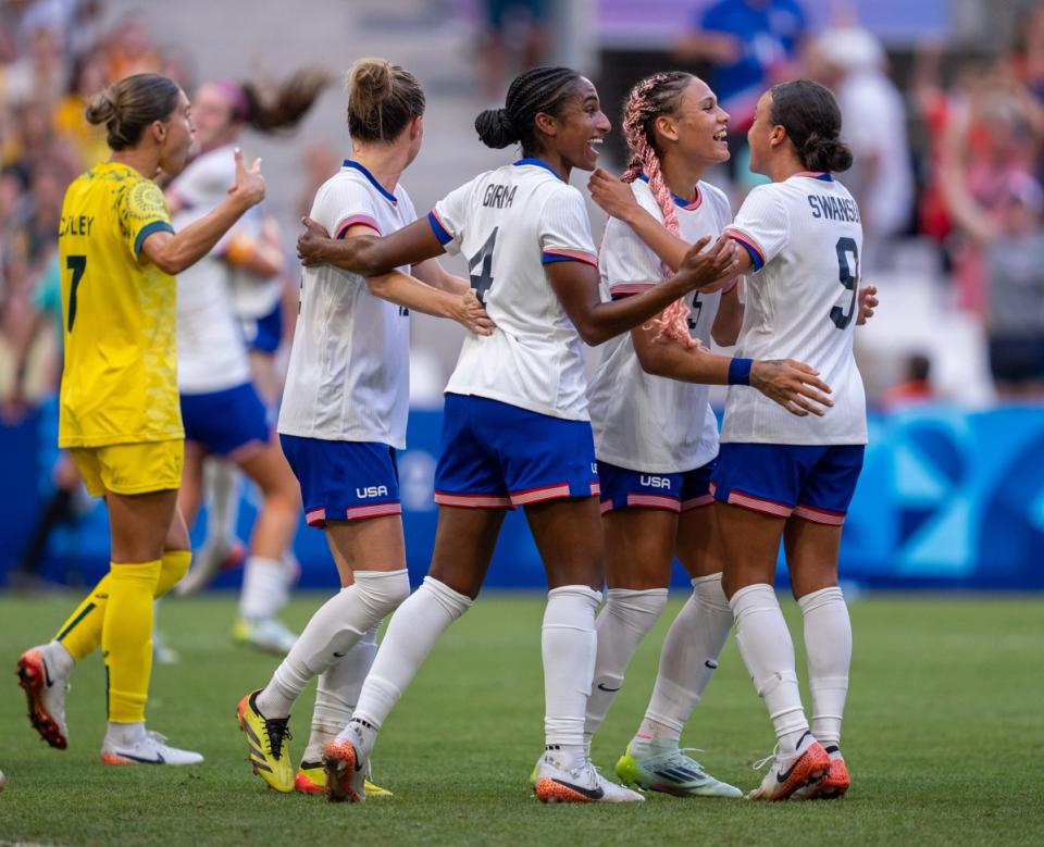 USWNT players celebrate Trinity Rodman's goal against Australia in the final match of the Olympic group stage.