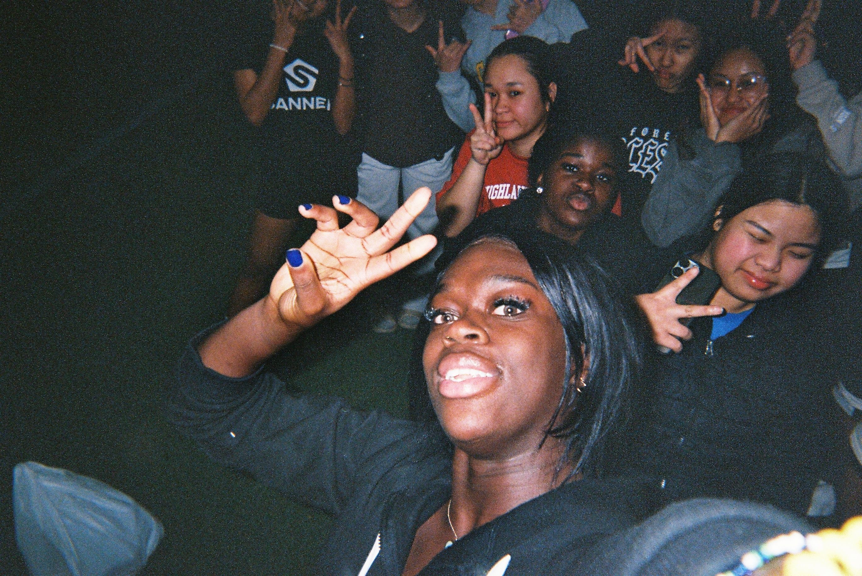 A coach and group of players posing for a photo.