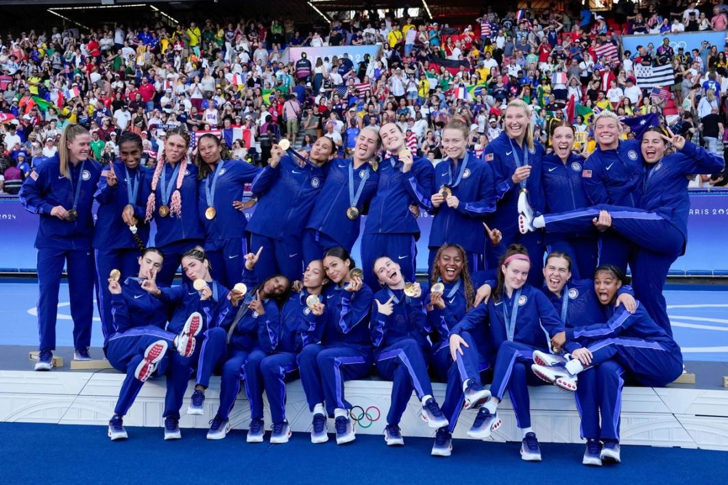 Members of the USWNT celebrate their gold medal at Paris 2024