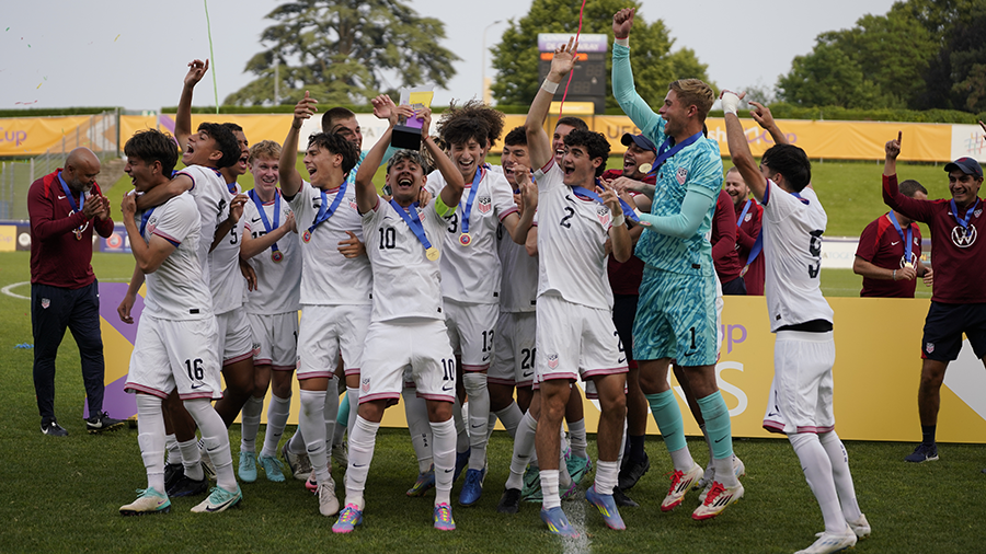 U20 Men's National Team celebrates by lifting trophy in the air