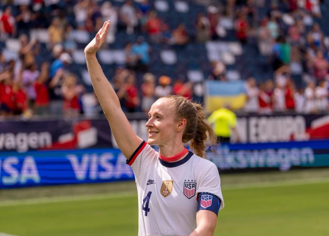 U.S. Women's National Team Captain Becky Sauerbrunn smiles and waves to the crowd from the field