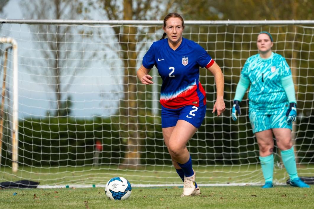 Cassidy Leake dribbles the ball down field against Ireland