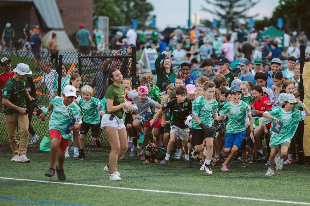 Kids running onto the pitch during a club event at Virtue Field | Image Credit: Vermont Green FC