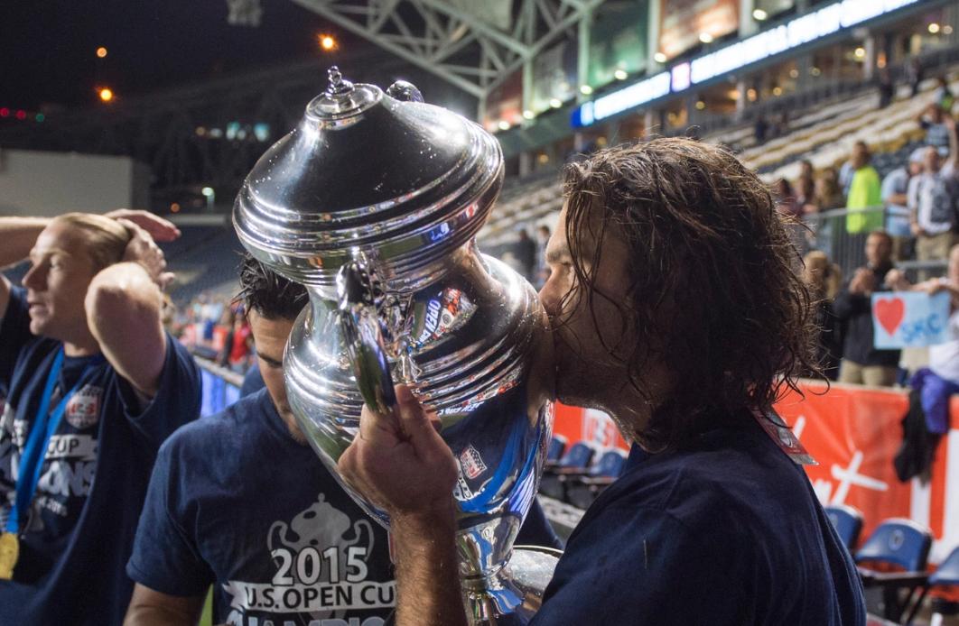 USMNT icon Graham Zusi gives the Open Cup trophy a kiss following the 2015 Final 