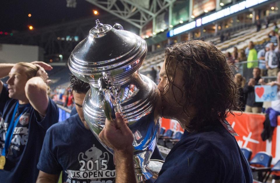 USMNT icon Graham Zusi gives the Open Cup trophy a kiss following the 2015 Final 