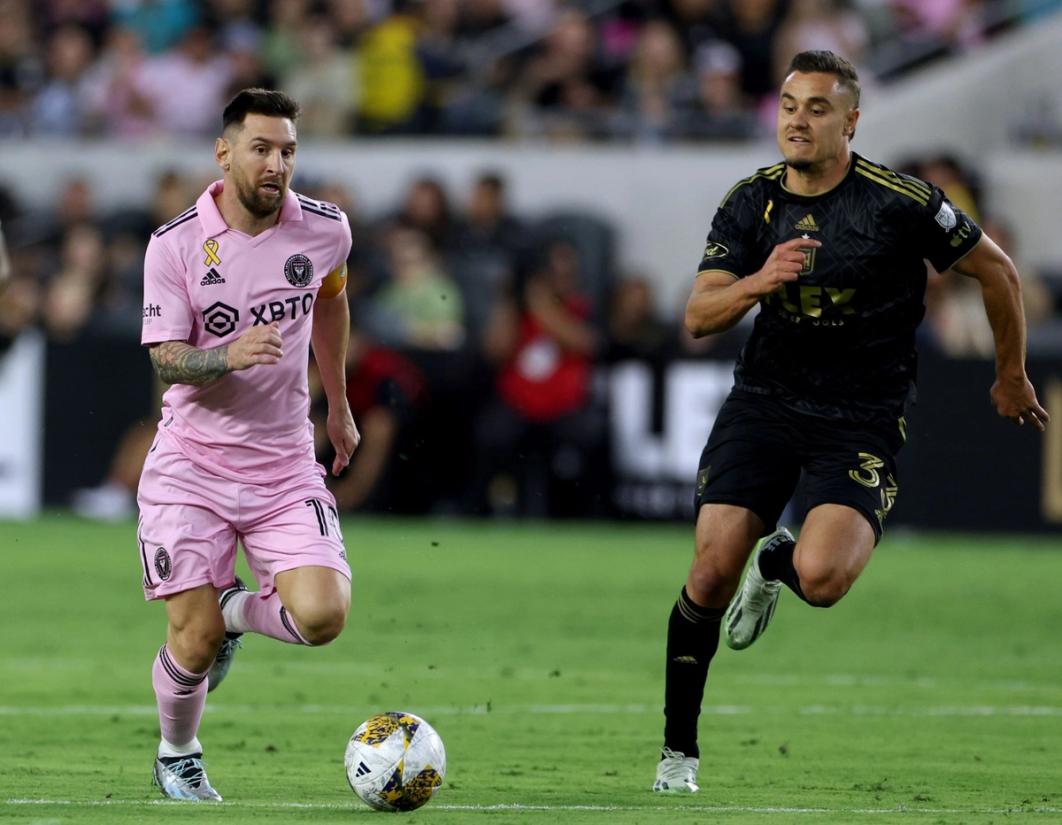Aaron Long chases after Lionel Messi during a match between Inter Miami CF and LAFC