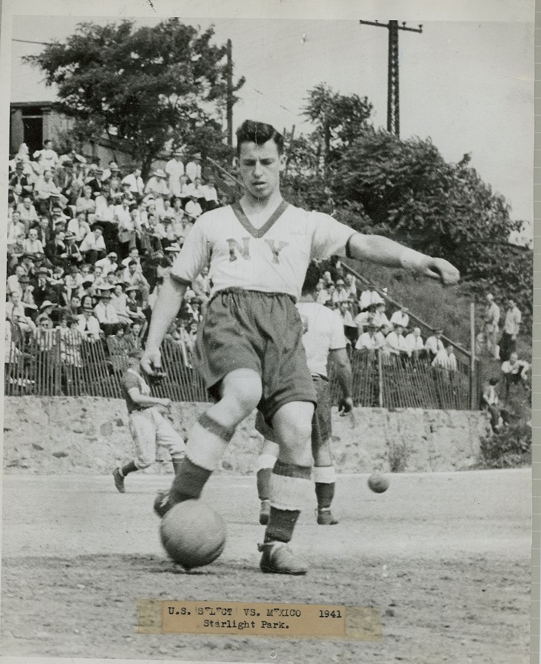 The late Jackie Hynes (seen above) is a New York City soccer legend. In addition to playing in a pair of U.S. Open Cup Finals, one with Brooklyn St. Mary’s Celtic and another with the New York Americans, he was an NYC Firefighter, four times capped for the USMNT – and earned a Purple Heart at the Battle of the Bulge during his military service in World War II. 