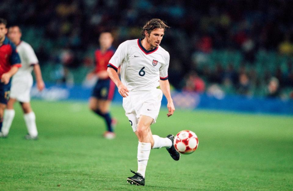 frankie hejduk in white kicking a ball with his backheel