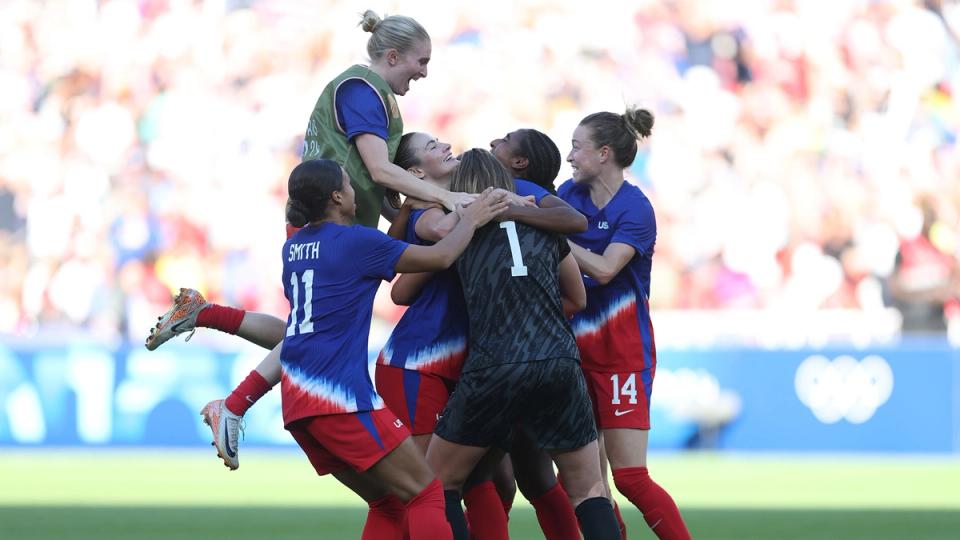 U.S. Women's National Team players celebrate after winning gold at the 2024 Summer Olympics.