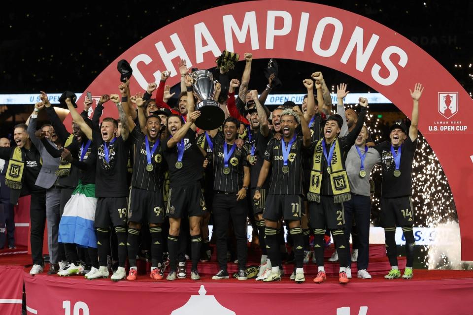 Los Angeles Football Club celebrates its U.S. Open Cup victory by raising the trophy on stage