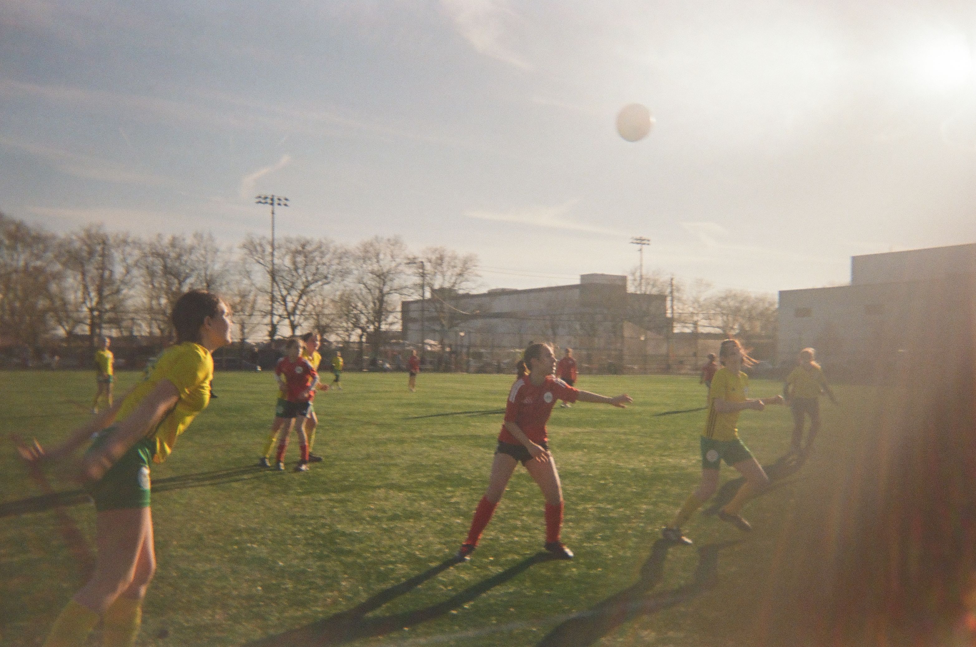 Girls playing a soccer game.