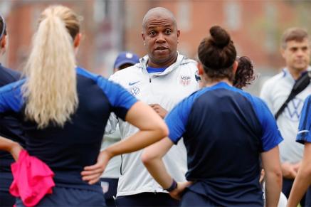 A coach instructs two players